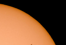ISS flying in front of the sun